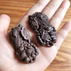 A pair of mini-sized zisha teapot figurines featuring a Qilin, designed for wealth attraction and creative tea culture, serving as exquisite tea accessories and tea toys.