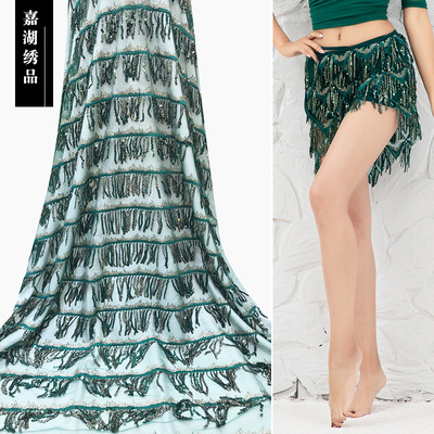 新款網紗亮片民族風女裝面料流蘇珠片滿幅舞蹈服時裝面料現貨供應