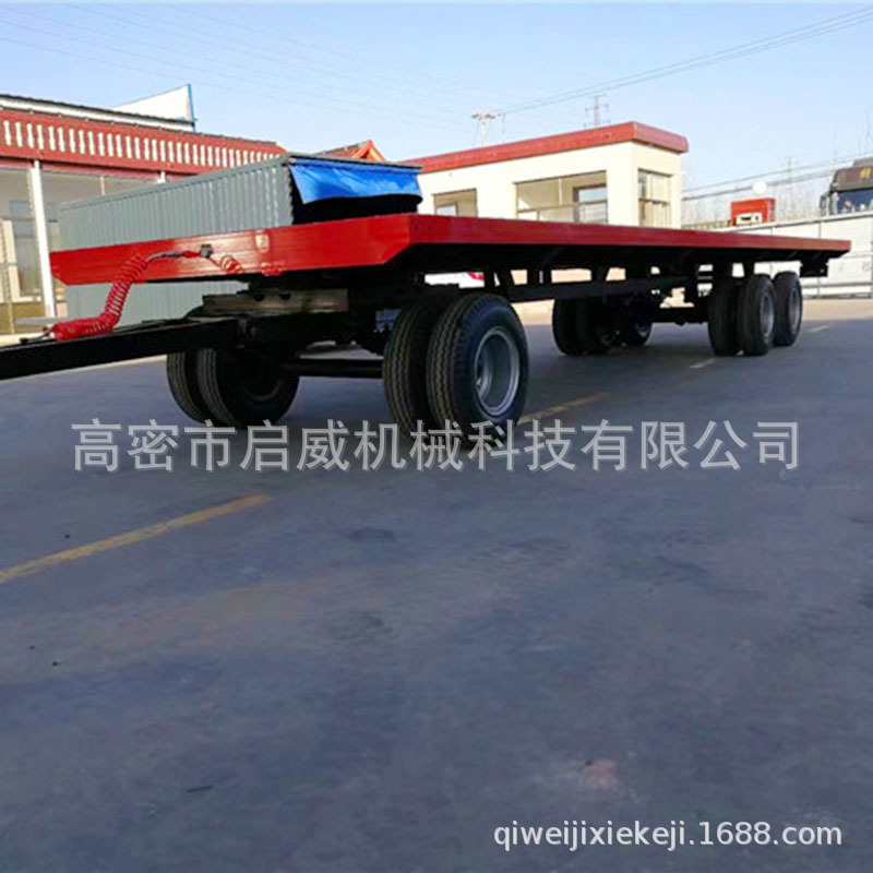 货源供应12轮充气胎平板拖车 大型牵引工业平板拖车厂家供应