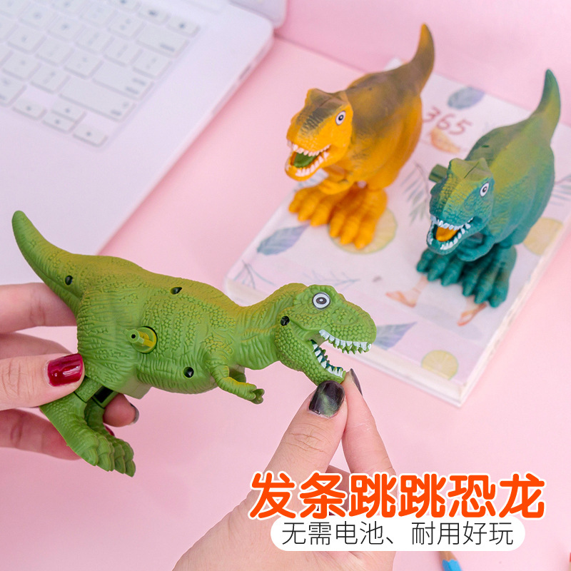 Primavera de juguete de dinosaurio de plástico salto de dinosaurio premio de kindergarten para niños pequeño regalo de la escuela regalo del Día de los niños