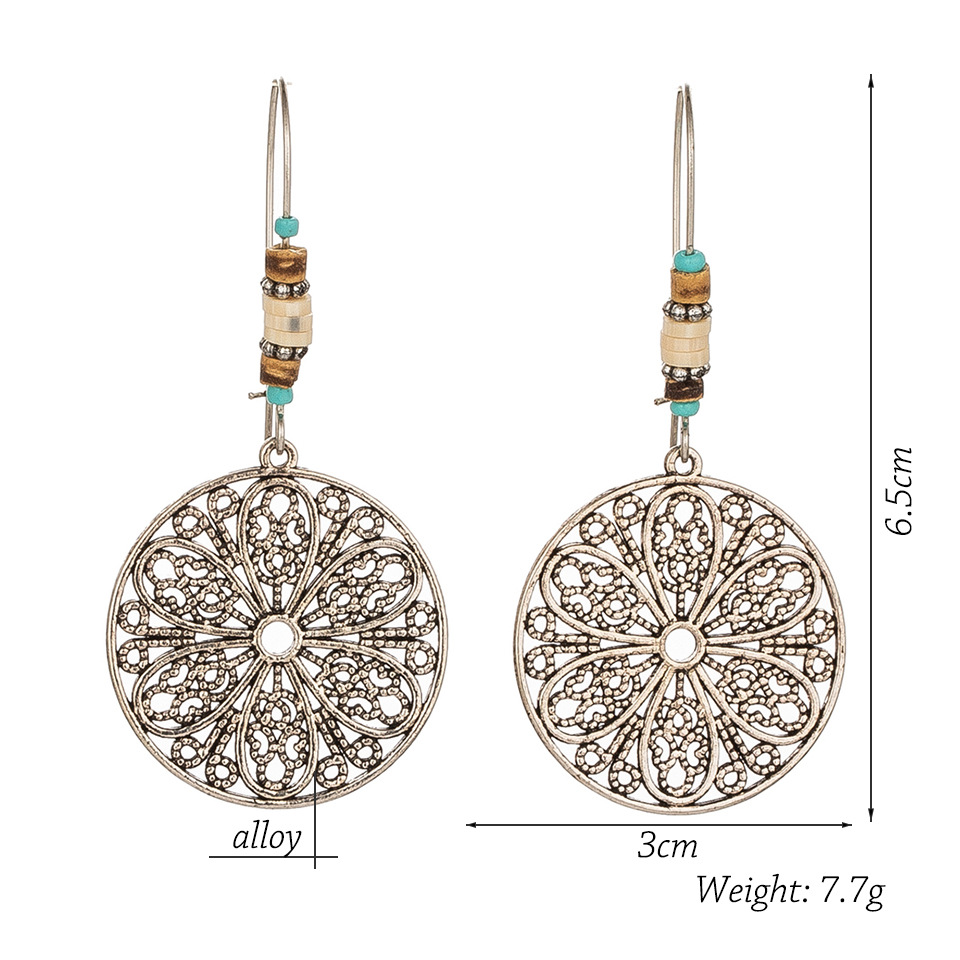Retro Old Hollow Round Flower Alloy Long Earrings display picture 1