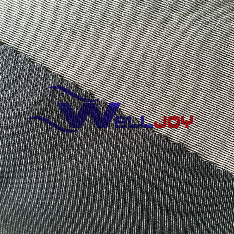 厂家供应 全涤纶右斜弹力开纤桃皮绒棉感斜纹风衣面料防水面料