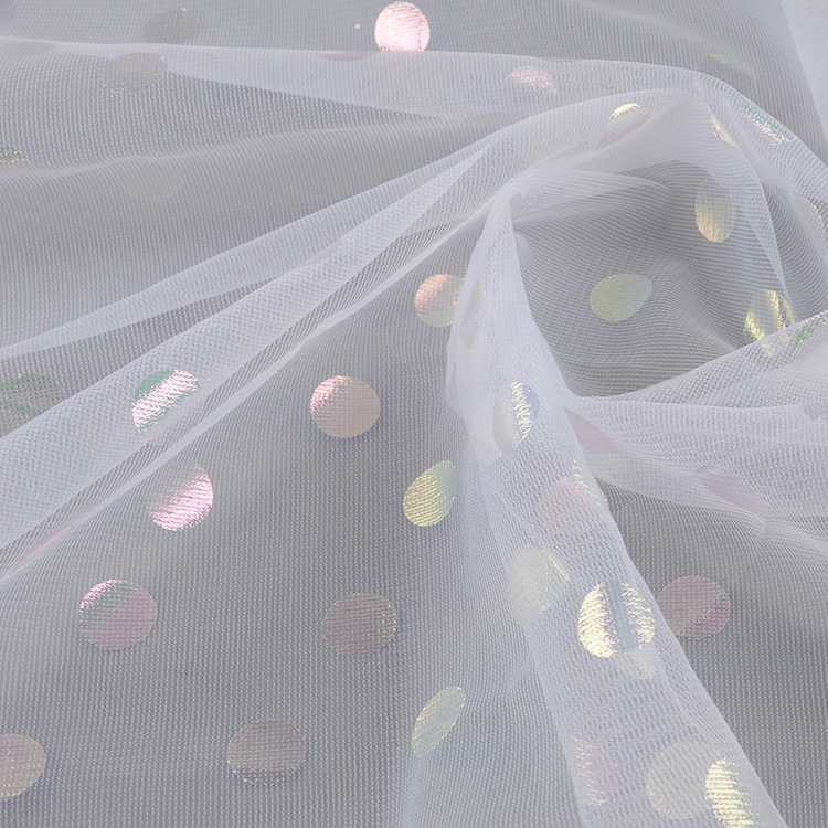 Fabricante suministro de punto láser estampado fantasía color blanco tela de malla de tela de ropa de chicas