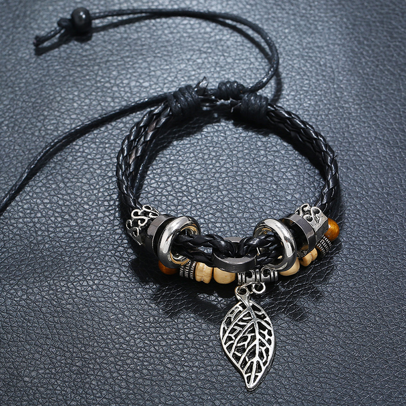 Korean Version Of Imitation Cowhide Bracelet Simple Wild Alloy Leaf Pendant Woven Leather Bracelet display picture 7