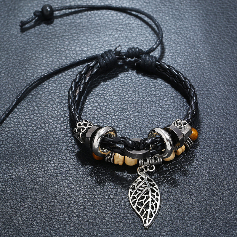 Korean version of imitation cowhide bracelet simple wild alloy leaf pendant woven leather bracelet