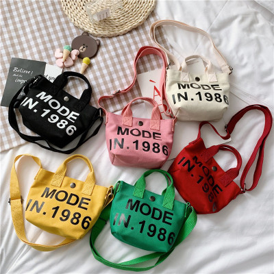 2021 Korean Edition children canvas The single shoulder bag fashion letter printing girl Messenger Travel package Accessories portable Small bag