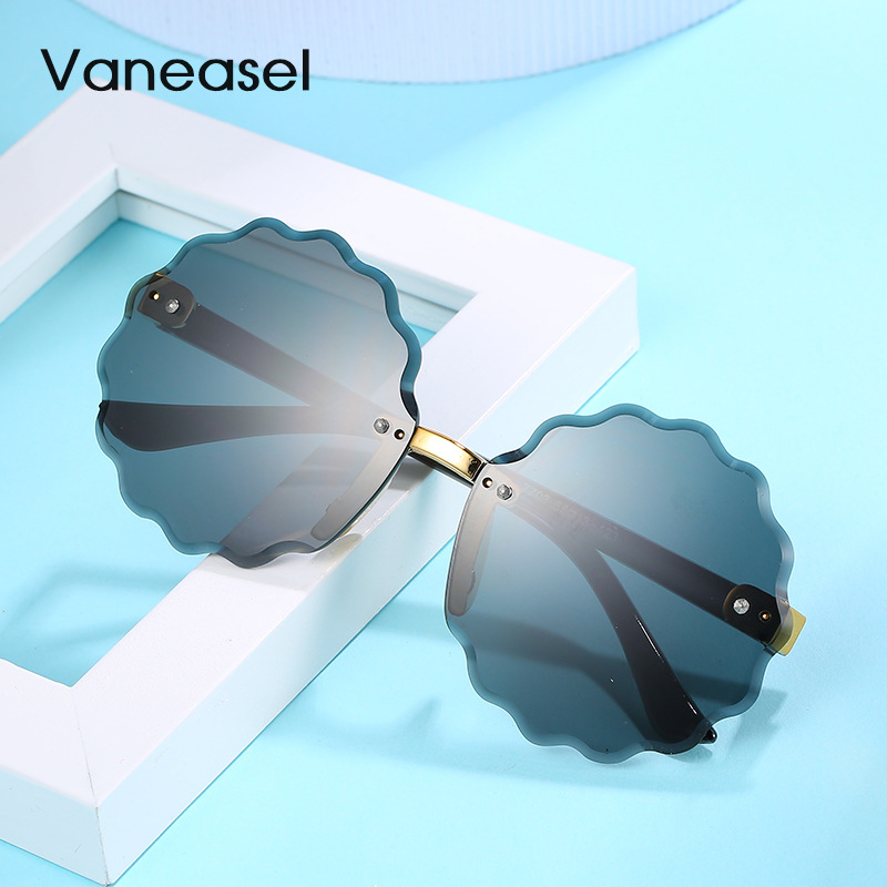 En stock al por mayor sin marco corte redondo onda encaje gafas de sol para niños moda multicolor océano pieza niños gafas de sol