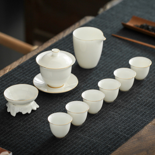 High-end white porcelain tea set with high-quality Dhua sheep fat jade, gold-trimmed ceramic Sandai cover bowl Gongfu tea set for wholesale