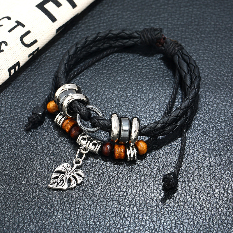 Fashionable leather multi-layer woven leaf pendant menu0027s bracelet explosion models wholesale