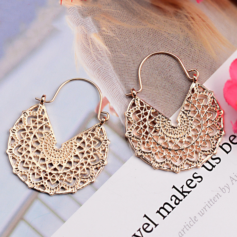 Retro Alloy Hollow Semicircular Carved Earrings Wholesale display picture 7