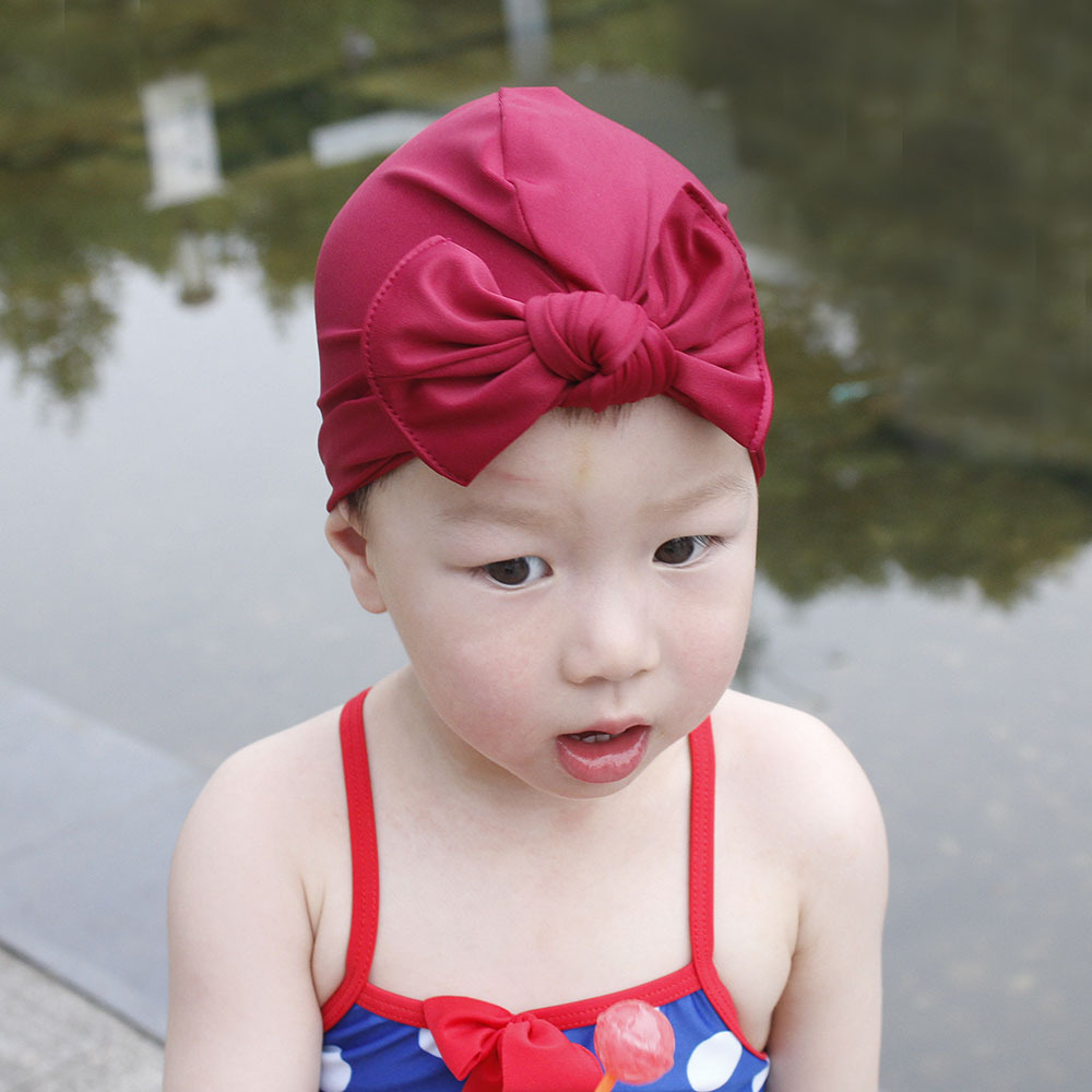Children&#39;s Swimming Cap Bowknot Hat Good Elasticity Solid Color Printing Baby Swimming Cap display picture 14