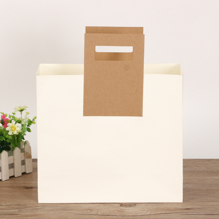 创意手提袋定制 服装店牛皮纸袋加厚服饰礼品购物袋子加印LOGO