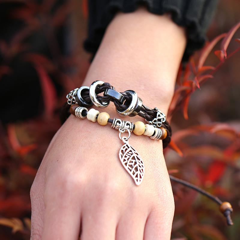 Korean version of imitation cowhide bracelet simple wild alloy leaf pendant woven leather bracelet