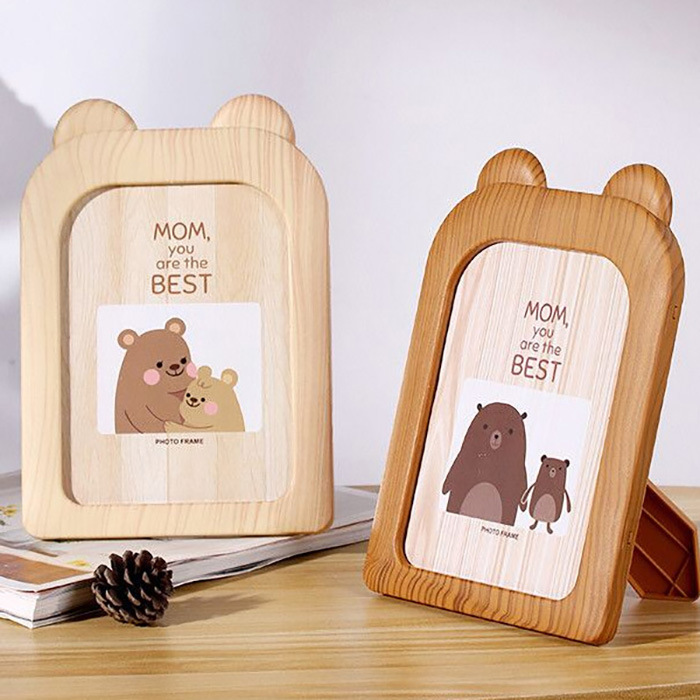 Artificial wood grain 7-inch photo frame 7-inch bear cartoon photo frame studio wholesale company gifts 10 yuan store supply