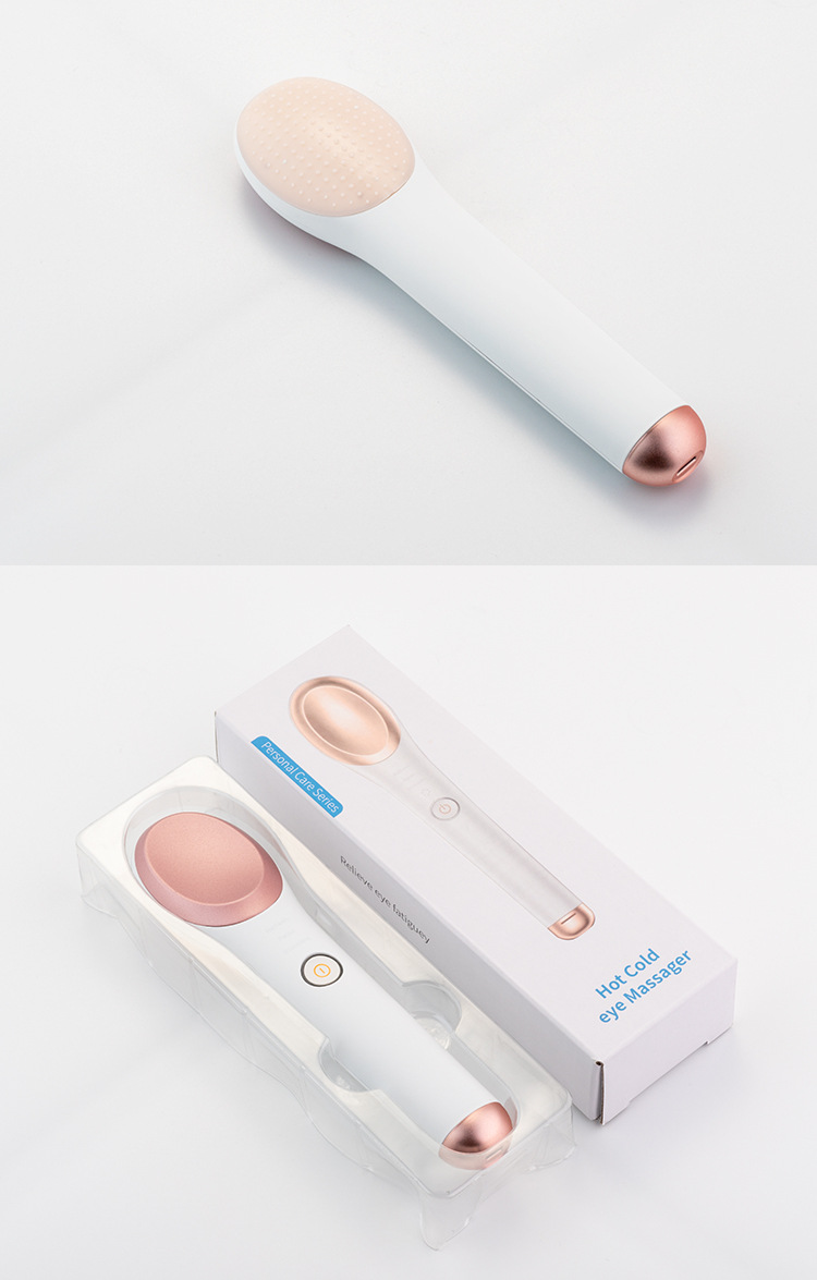 White colored eye and face massager with hot and cold therapy sonic vibration stick for facial massaging