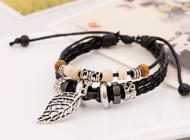 Korean version of imitation cowhide bracelet simple wild alloy leaf pendant woven leather bracelet