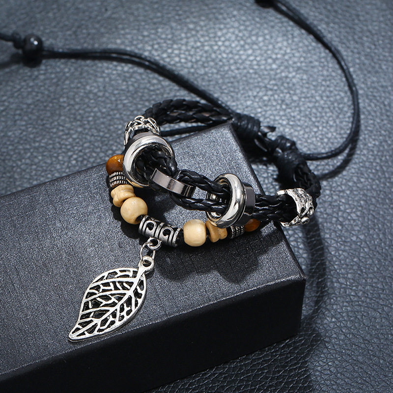 Korean Version Of Imitation Cowhide Bracelet Simple Wild Alloy Leaf Pendant Woven Leather Bracelet display picture 6
