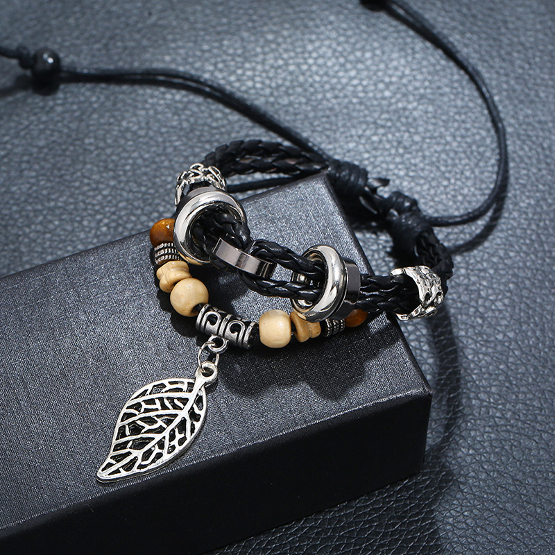 Korean version of imitation cowhide bracelet simple wild alloy leaf pendant woven leather bracelet