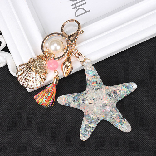Factory direct supply European style new starfish keychain creative tassel car pendant alloy ladies bag pendant