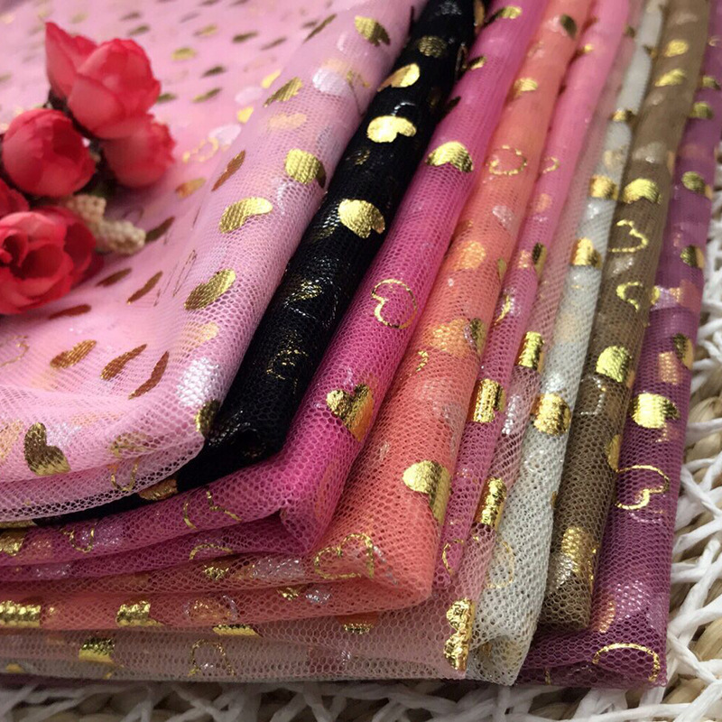 厂家专业加工涤纶经编桃心烫金银网纱工艺舞台服女装网眼布面料