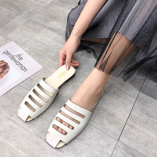 Giày lười trắng Muller nữ phẳng 2019 hè mới Dép nửa đầu nữ nửa rỗng kéo Dép da