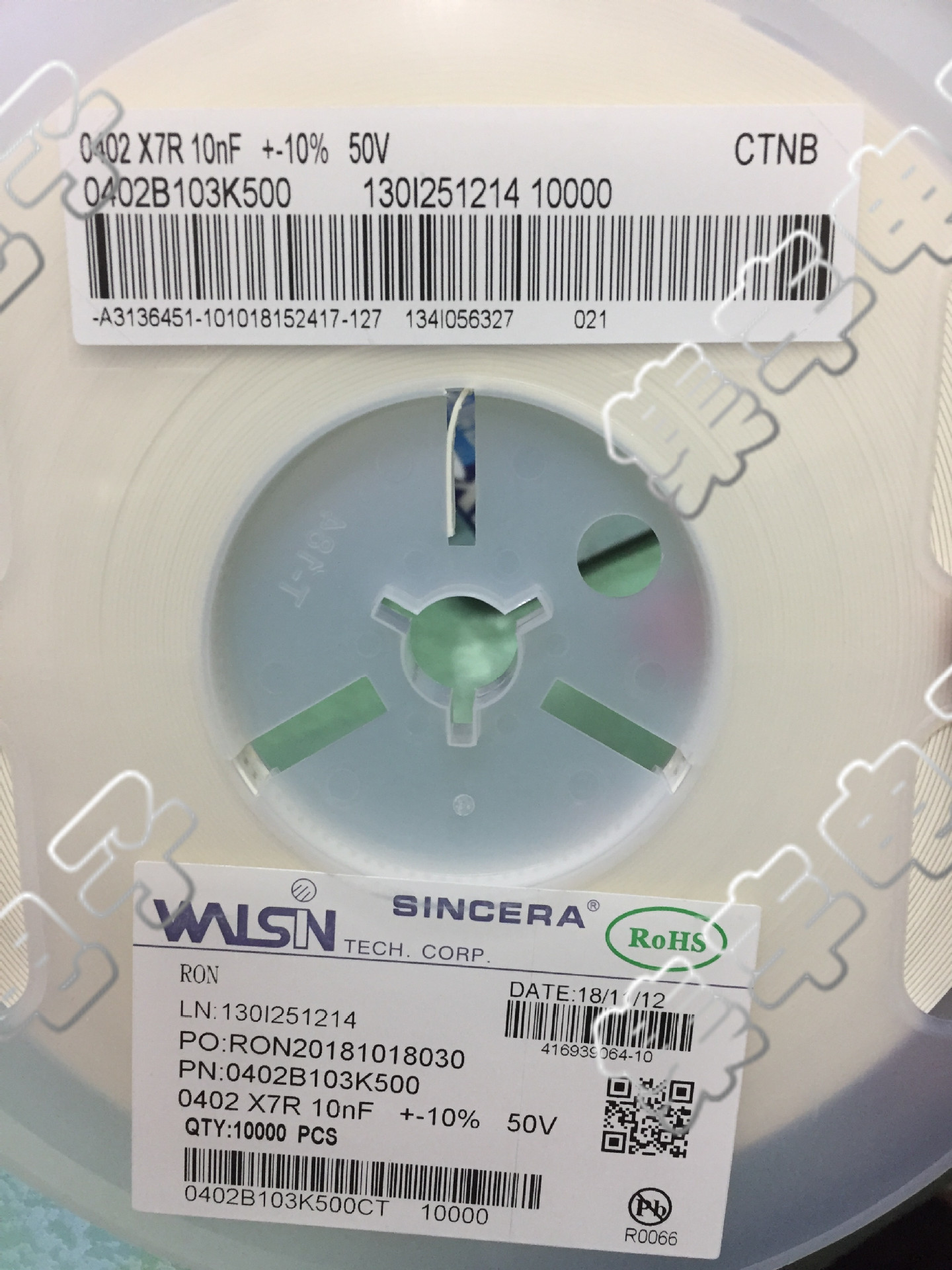 贴片华新电容 0402(1005) 103K 10nF 50V 10% 实物拍摄