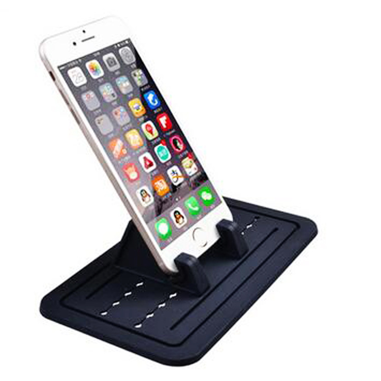 車の携帯電話のスタンドのシリカゲルパッドのゴムの中でコンソールのタブレットのスタンドのデスクトップのアイデアの自動車のナビゲーションの携帯電話のスタンド