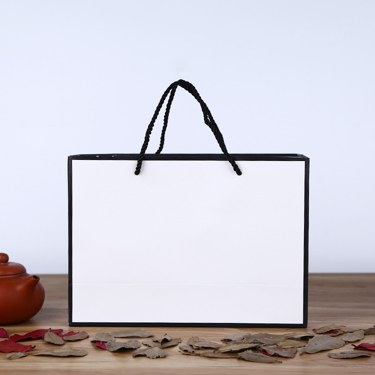 厂家供应牛皮纸袋 白卡纸服装手提袋UV印刷手提购物袋可印LOGO