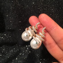 S925銀針韓國時尚創意盤繞小蛇耳環可愛珍珠彎曲蛇耳飾網紅潮人