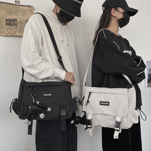 Hong Kong fashion brand couple shoulder backpack new Korean version simple male and female student crossbody bag tooling tutorial bag