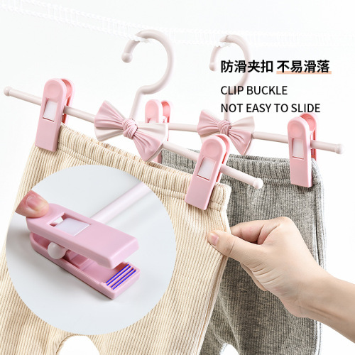 Plastic seamless clothes hanger wholesale children's telescopic trouser rack trouser clip baby baby non-slip clothes support home clothes hanger