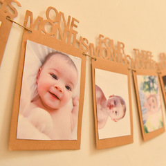 Factory-direct baby birthday photo frame & bunting set for kids—12-month milestone, made from kraft paper, with photo clips and decorative flower accents for your photo wall.