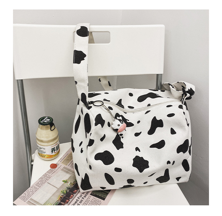 Korean New Simple Lazy Style Cute Cow Polka Dot Student Canvas Bag Class Bag Wild Messenger Bag Wholesale display picture 40