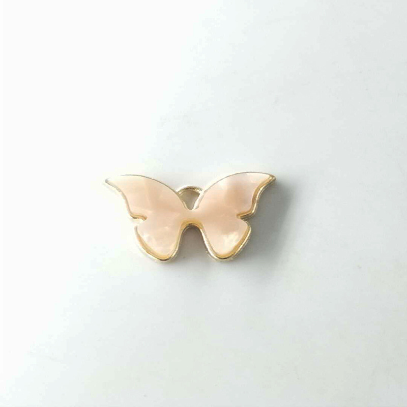 Transfronterizo Venta caliente accesorios de joyería de moda europea y americana DIY aleación resina color mariposa accesorios de joyería colgante único