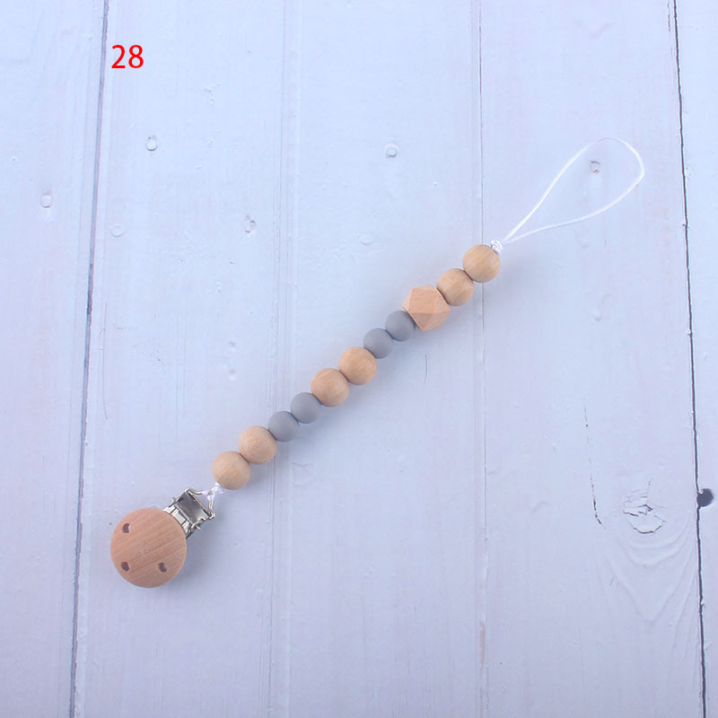 Nueva fábrica directa bebé Beech juguete mordedor bebé chupete de silicona pezón anti-gota cadena materna y infantil suministros