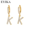 Fashionable earrings with letters, big zirconium, micro incrustation