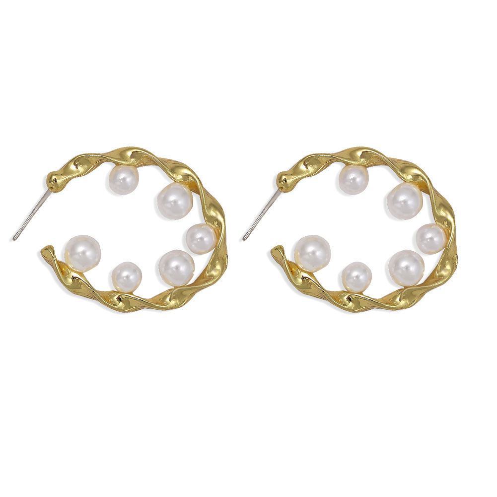 Pure White Pearl Inlaid Wavy Round Hollow Creative Fashion Earrings Wholesale display picture 10