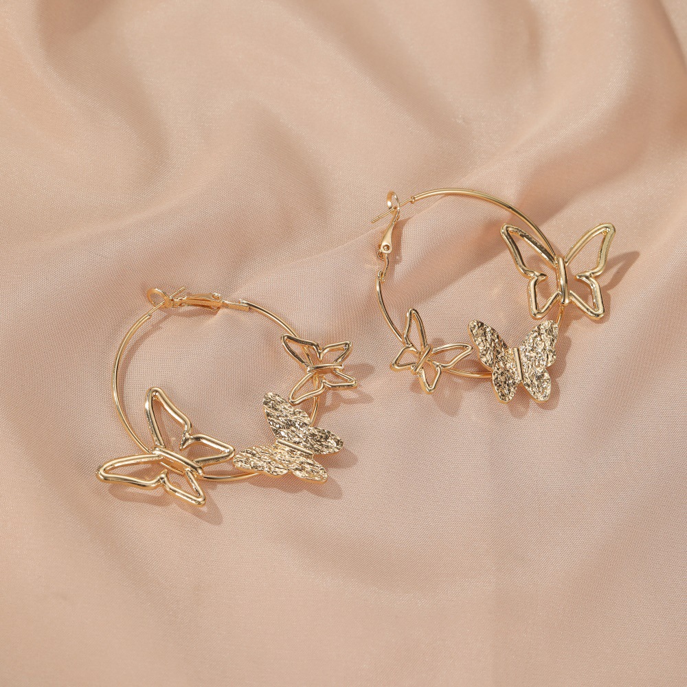 Nouvelle Personnalité Simple Exagérée Boucles D&#39;oreilles Trois Papillons Creux En Gros display picture 6