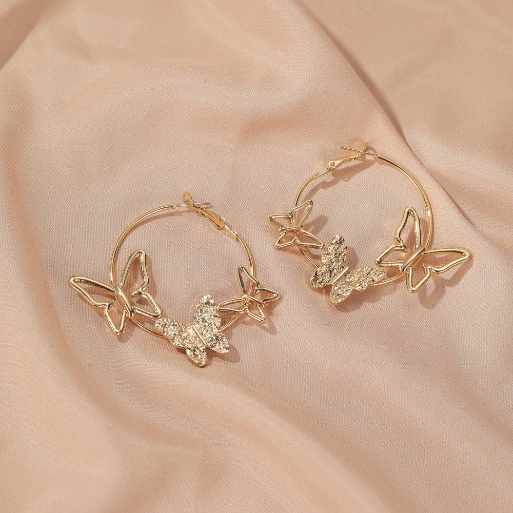 Nouvelle Personnalité Simple Exagérée Boucles D&#39;oreilles Trois Papillons Creux En Gros display picture 8