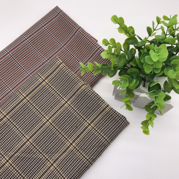 爆款新品涤纶弹力面料 千鸟格色织西装套装布 tr面料成品现货供应