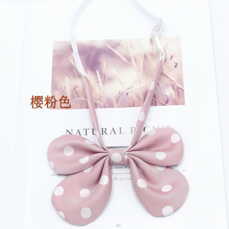 Pluma curvada raíz conejo oreja collar flor pajarita femenina estilo coreano lunares lindo arco JK uniforme pajarita fabricante en stock