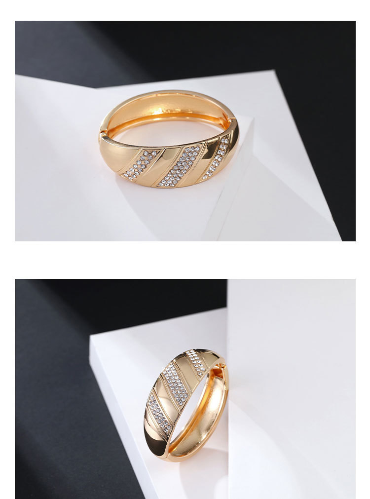 curved smooth diamond gold-plated spring bracelet