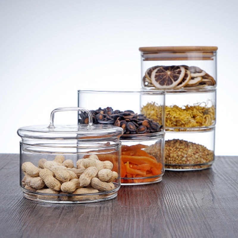 Fábrica al por mayor de bambú cubierta de vidrio ensaladera borosilicato vidrio resistente al calor Sellado tarro de alimentos de grano