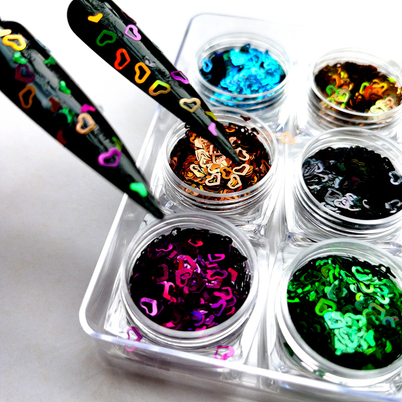 Heart-shaped nail art glitter, hollowed-out heart-shaped glitter, irregularly shaped decorative heart-shaped beads, cross-border crystal clay glitter.