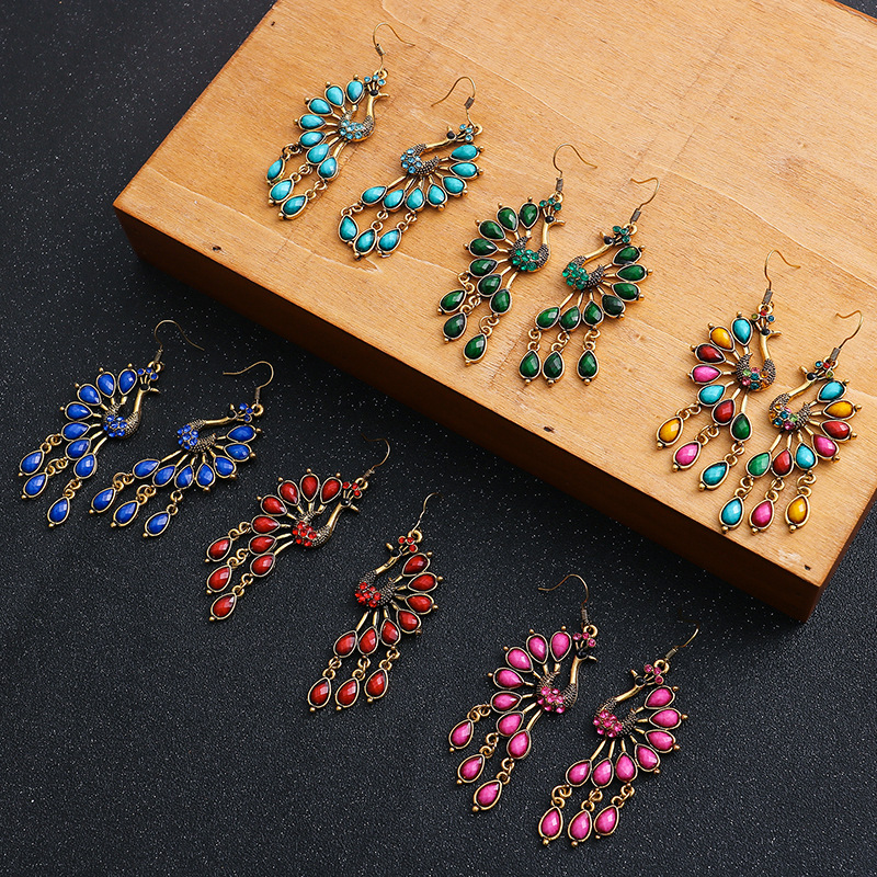 Retro Peacock Ethnic Style Hollow Long Earrings Inlaid Diamond Alloy Earrings display picture 1