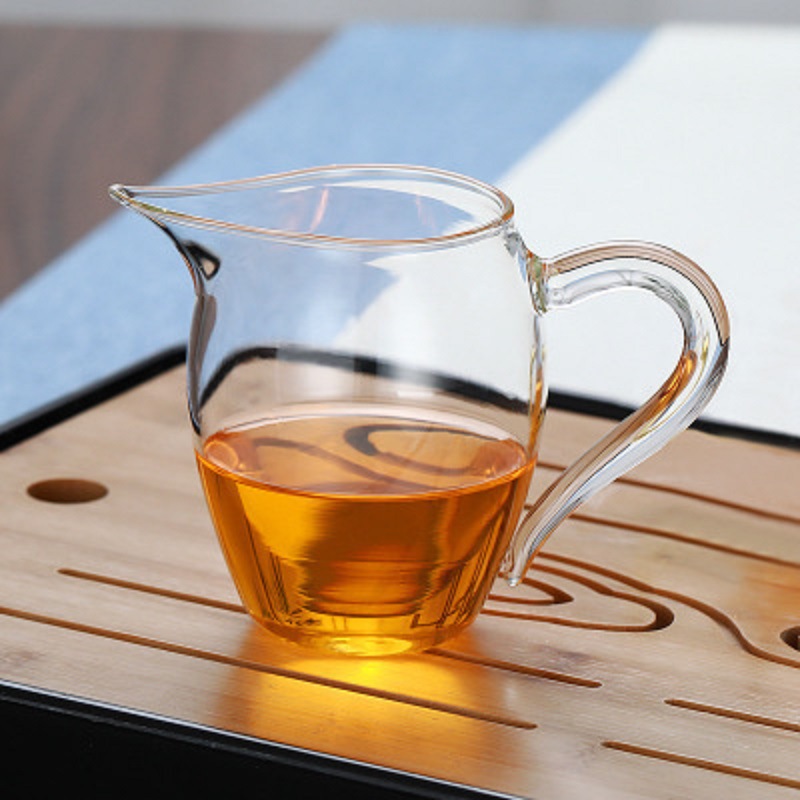 Fábrica al por mayor de vidrio borosilicato taza justa engrosada transparente té mar grande dispensador de té taza justa Kung Fu juego de té