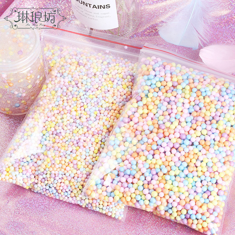 Macaron color bola de espuma TikTok caja de regalo flujo de partículas planeta caja de regalo Internet celebridad relleno 25g ventas directas de fábrica