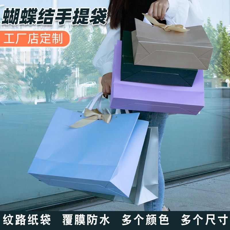 现货铆钉特种纹路纸袋服装店金色银色纯色女装开业纸包装手提袋子