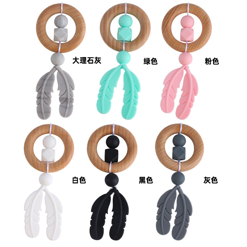 Nueva historieta DIY Beech anillo de mano molar de juguete mordedor infantil pluma de silicona perlas dientes de molienda palo