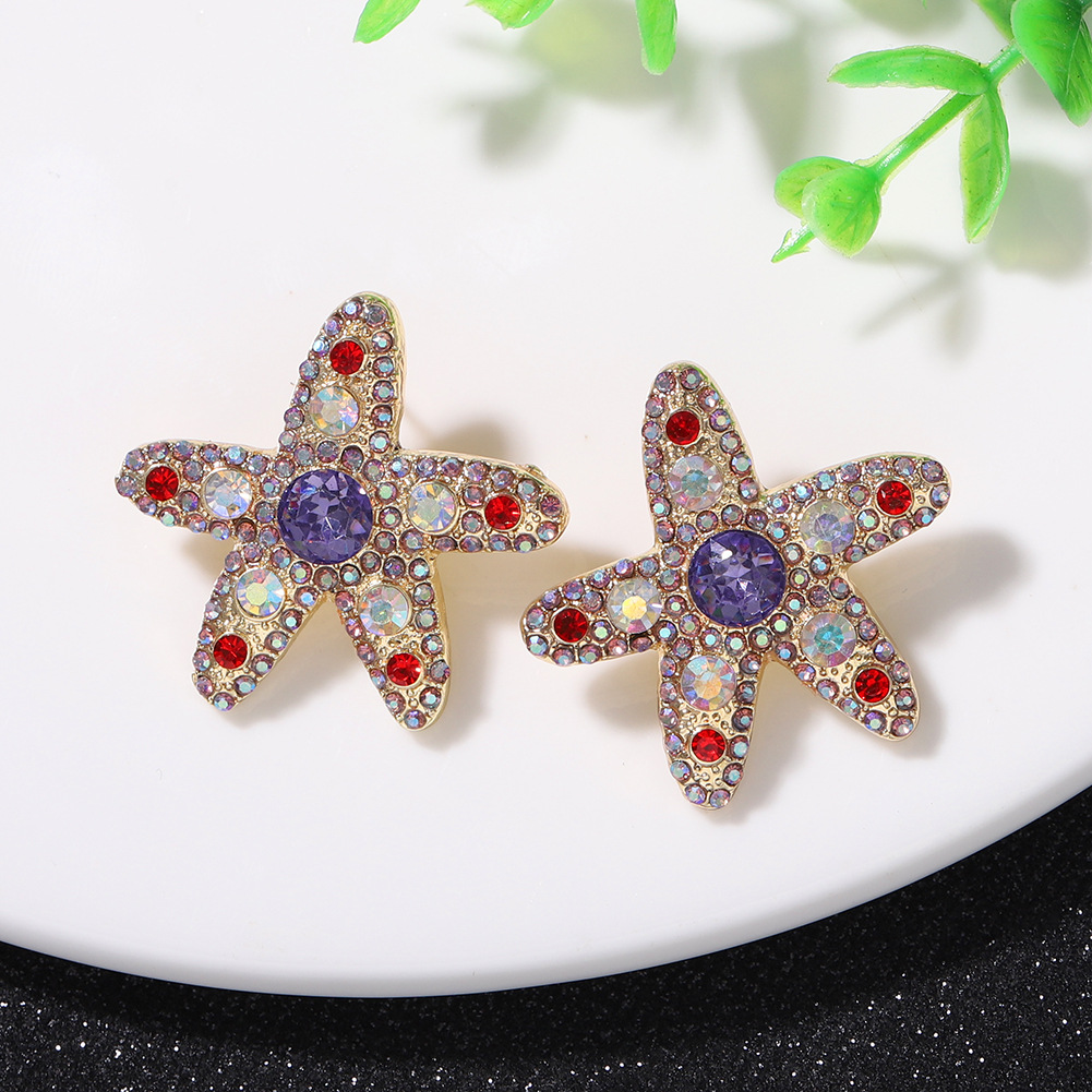 Pendientes Salvajes De Diamantes De Color De Estrella De Mar Personalizados De Moda Súper Flash De Cinco Puntas En Forma De Estrella Lindos Pendientes De Temperamento Japonés Y Coreano Al Por Mayor display picture 1